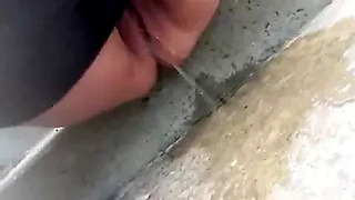 Close-up BBW with large bald pussy public street peeing 1