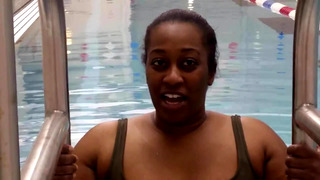 BBW Black woman put a pink latex swimcap