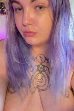 My sexy, purple-haired, tatted BBW self, seductively puffing away, hungrily eyeing your cock